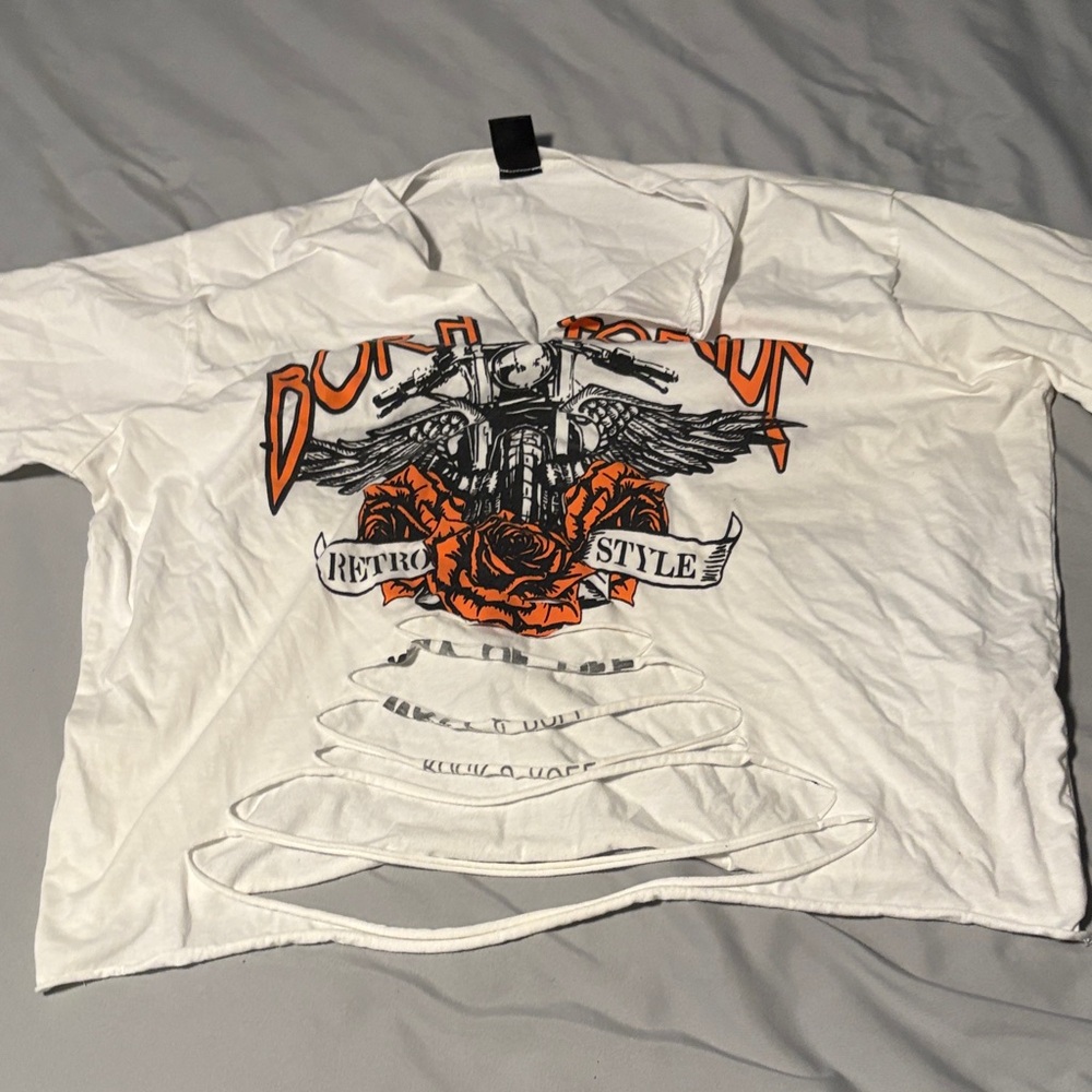 White ripped cropped t-shirt.